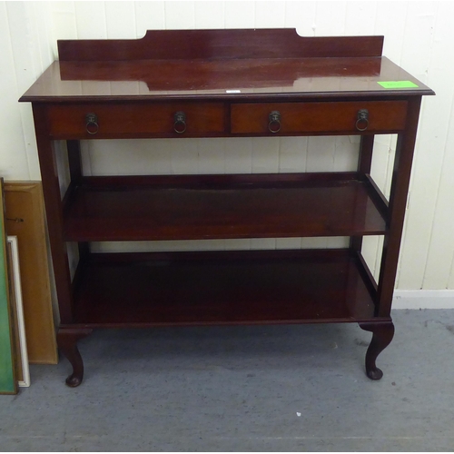 203 - An Edwardian three tier buffet with two drawers, raised on cabriole legs&nbsp; 42