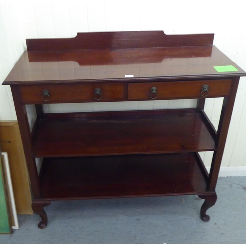 203 - An Edwardian three tier buffet with two drawers, raised on cabriole legs&nbsp; 42