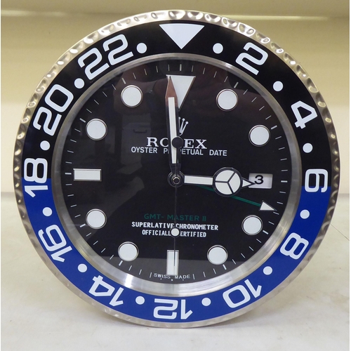 205 - A Rolex Oyster Quartz dealers display wall clock&nbsp; no.A6409&nbsp; 13.5
