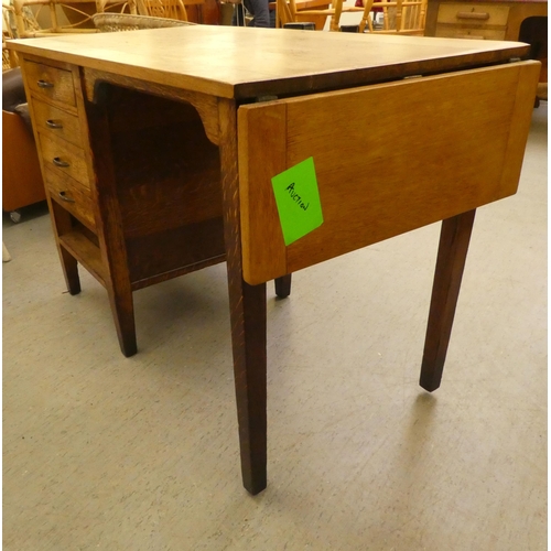 207 - A modern oak single pedestal desk with four drawers, raised on block legs&nbsp; 29