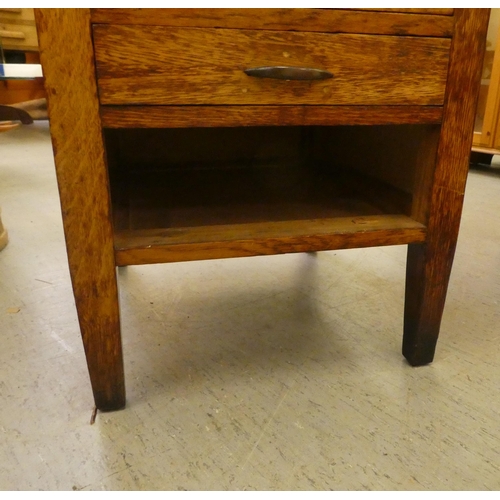 207 - A modern oak single pedestal desk with four drawers, raised on block legs&nbsp; 29