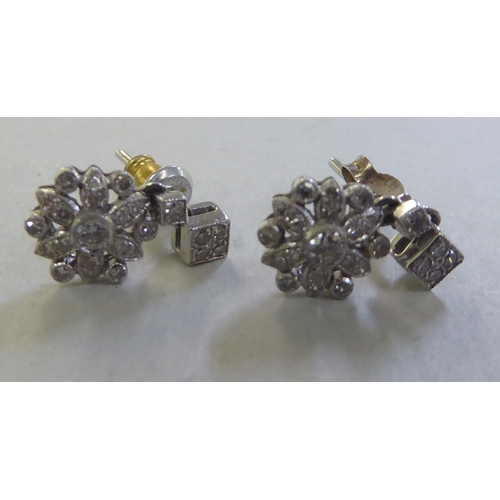 209 - A pair of 18ct gold flower drop diamond earrings&nbsp;