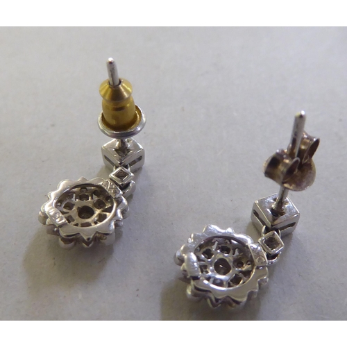 209 - A pair of 18ct gold flower drop diamond earrings&nbsp;
