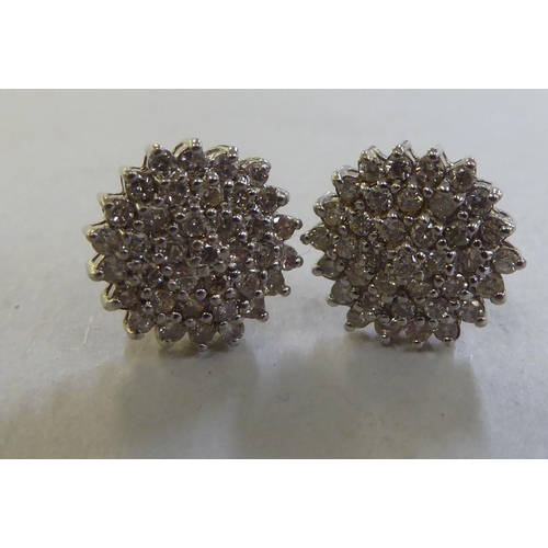 214 - A pair of 9ct gold diamond cluster earrings&nbsp;