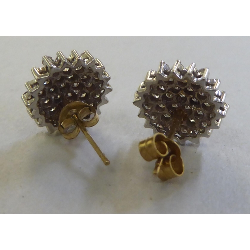 214 - A pair of 9ct gold diamond cluster earrings&nbsp;