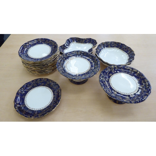 217 - An early 20thC Wedgwood china dessert service, decorated with a gilded blue band&nbsp;