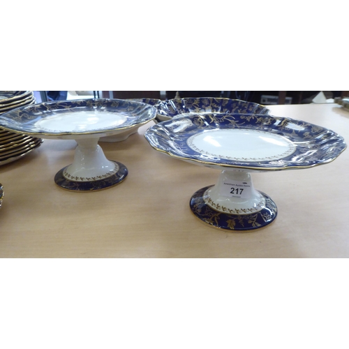 217 - An early 20thC Wedgwood china dessert service, decorated with a gilded blue band&nbsp;
