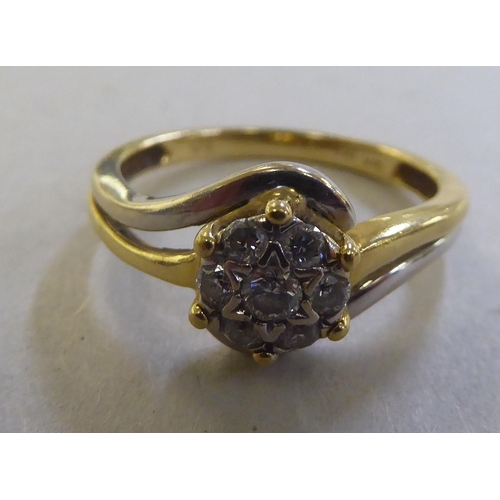 219 - An 18ct gold diamond crossover cluster ring&nbsp;