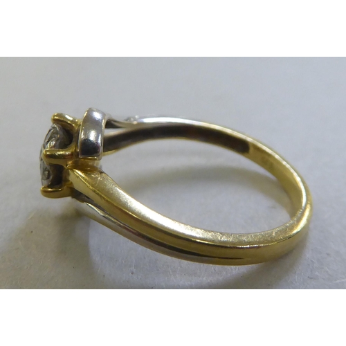 219 - An 18ct gold diamond crossover cluster ring&nbsp;