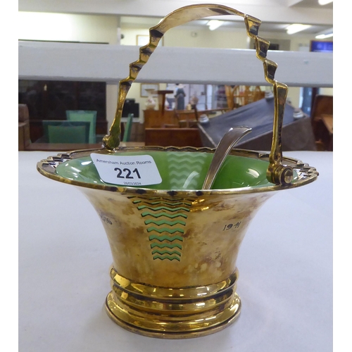 221 - A Mappin & Webb silver sugar basket with a green glass liner and matching spoon&nbsp; Sheffield ... 