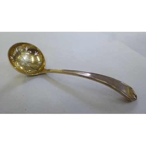 221 - A Mappin & Webb silver sugar basket with a green glass liner and matching spoon&nbsp; Sheffield ... 