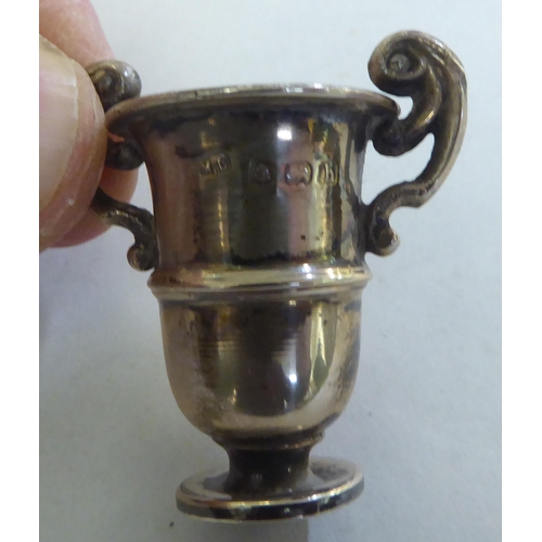 227 - Silver and white metal collectables: to include a late Victorian pill box&nbsp; London 1896&nbsp;
