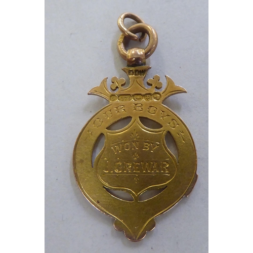 228 - A late Victorian 9ct gold pendant football medal&nbsp; 1889&nbsp;