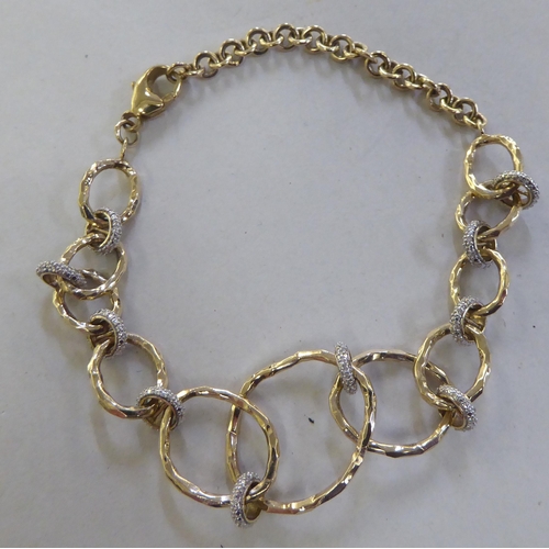 234 - A 9ct gold rustic design bi-coloured diamond set bracelet&nbsp;