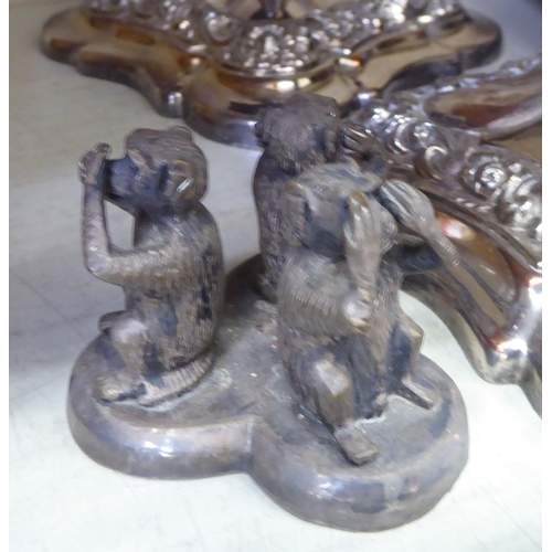 236 - Metalware: to include a pair of silver plated candlesticks, embossed with swags  8