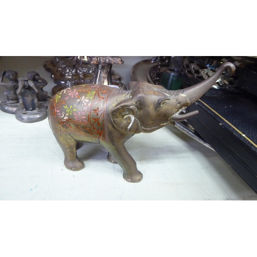 236 - Metalware: to include a pair of silver plated candlesticks, embossed with swags  8