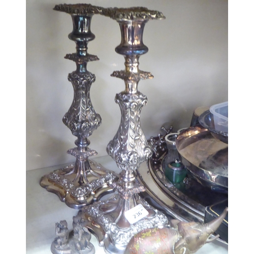 236 - Metalware: to include a pair of silver plated candlesticks, embossed with swags  8