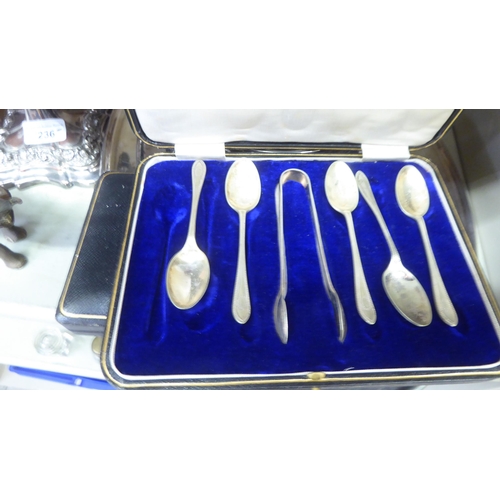 236 - Metalware: to include a pair of silver plated candlesticks, embossed with swags  8
