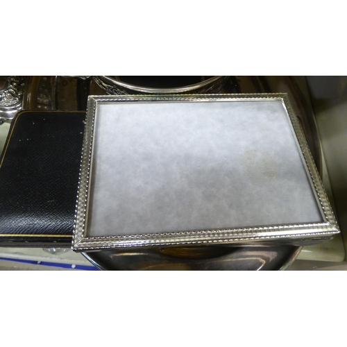 236 - Metalware: to include a pair of silver plated candlesticks, embossed with swags  8