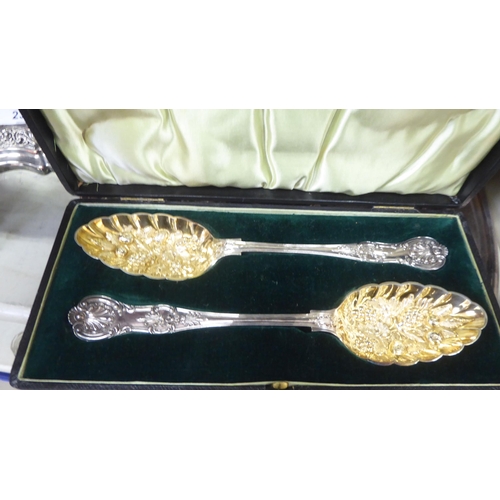 236 - Metalware: to include a pair of silver plated candlesticks, embossed with swags  8