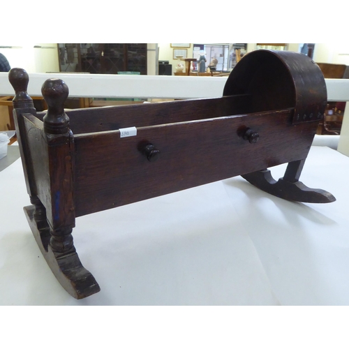 237 - A dolls late Victorian oak rocking crib  18