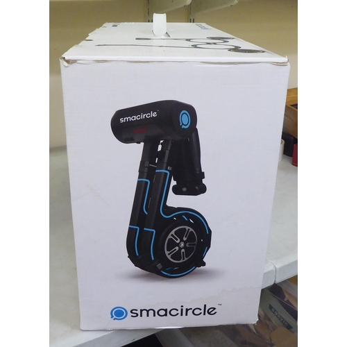 238 - A Smacycle S1 folding electric bicycle and back pack  boxed