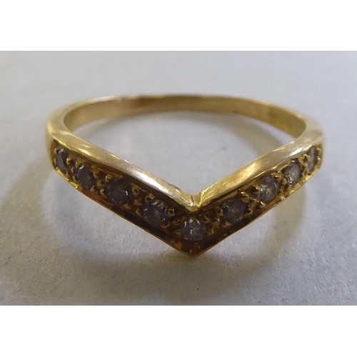 240 - An 18ct gold wishbone design diamond set ring&nbsp;