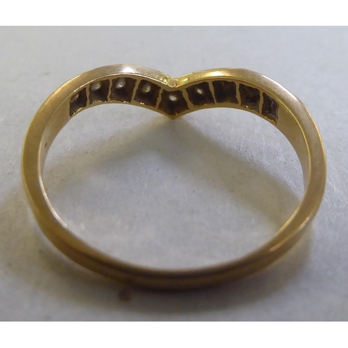240 - An 18ct gold wishbone design diamond set ring&nbsp;