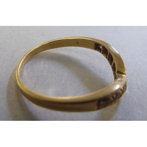 240 - An 18ct gold wishbone design diamond set ring&nbsp;