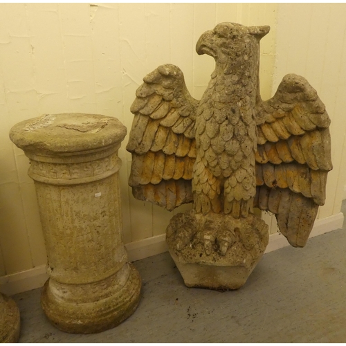 241 - A pair of late 1950s composition stone grotesque birds on separate stone columns  69