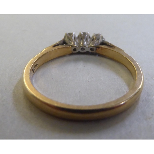 255 - A 9ct gold three stone diamond ring&nbsp;