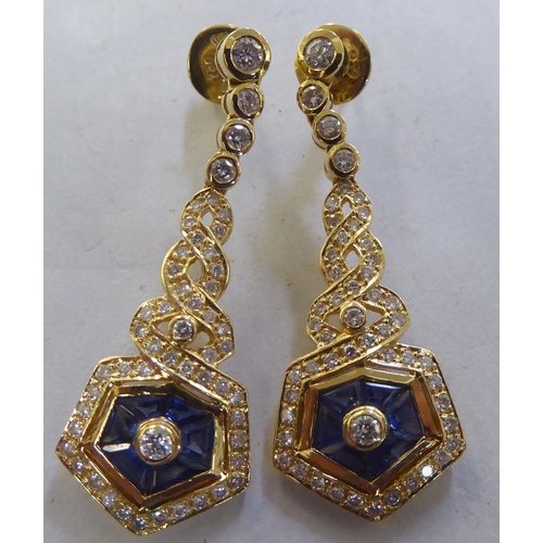 260 - A pair of 18ct gold diamond and sapphire pendant earrings 