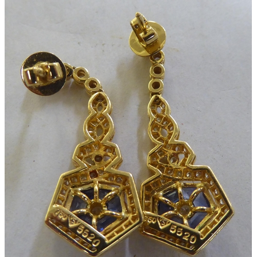 260 - A pair of 18ct gold diamond and sapphire pendant earrings 