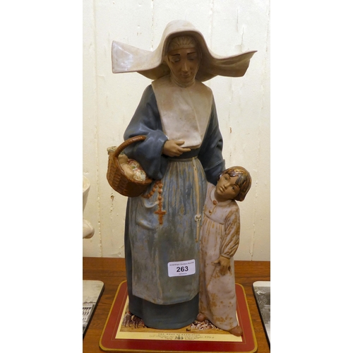 263 - A Lladro porcelain group, a nun and child  16