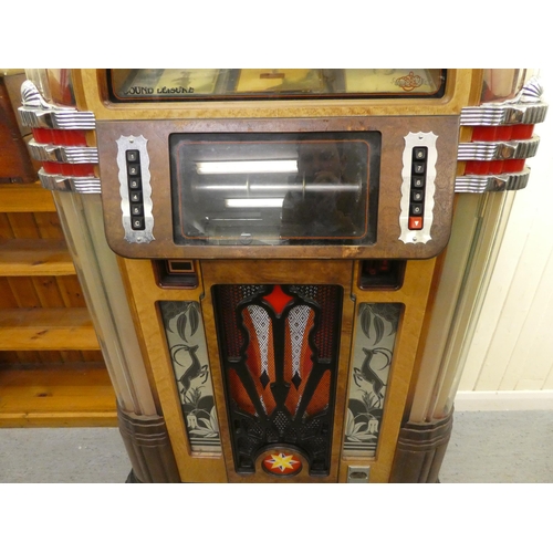 266 - An American design wood finished compact disc juke box  60