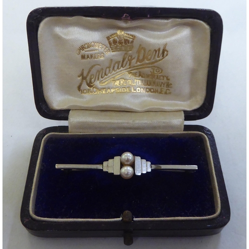 278 - An Art Deco 9ct white gold bar brooch, set with two pearls