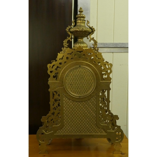 285 - A modern Victorian design, gilt metal cased mantel clock of ornate architectural design, faced by a ... 