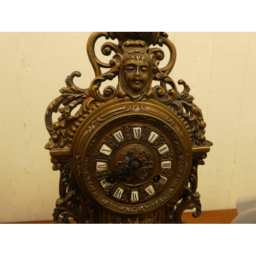 290 - A modern Victorian design, gilt metal cased mantel clock of ornate architectural design, faced by a ... 