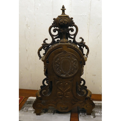 290 - A modern Victorian design, gilt metal cased mantel clock of ornate architectural design, faced by a ... 