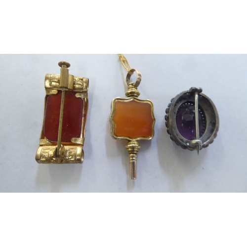 291 - Items of personal ornament: to include a yellow metal cameo brooch; and pendant watch key