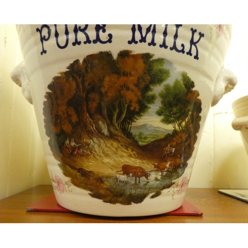 300 - An Ironstone china twin handled milk pail of tapered form; and a matching cream crock