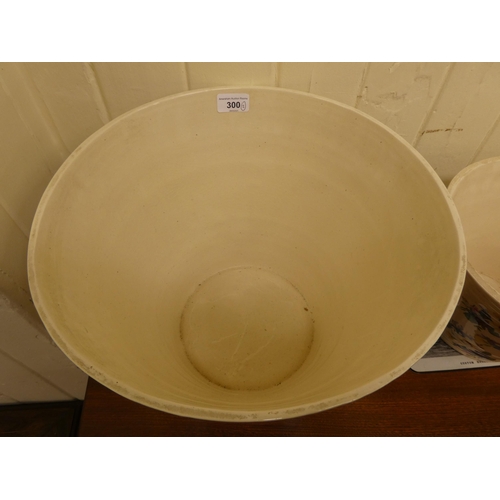 300 - An Ironstone china twin handled milk pail of tapered form; and a matching cream crock