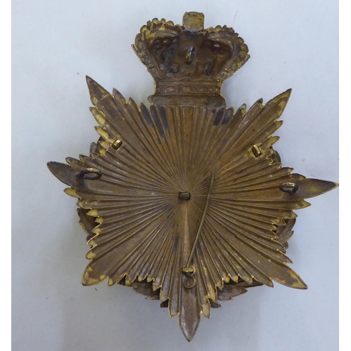 309 - A Norfolk Regt. helmet plate (Please Note: this lot is subject to the statement made in the Auc... 