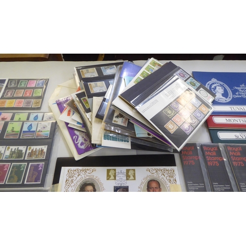 310 - Uncollated postage stamps, mostly presentation and collectors packs 