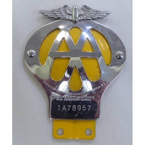 317 - A mixed lot: to include a chromium and enamelled AA badge 