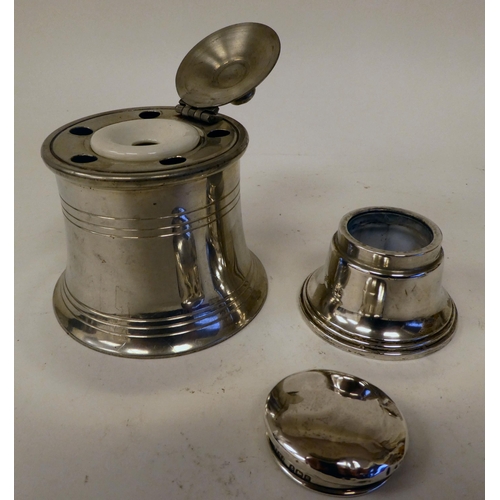 4 - A miscellany of early 20thC and later inkwells: to include an example in silver, of capstan design&n... 