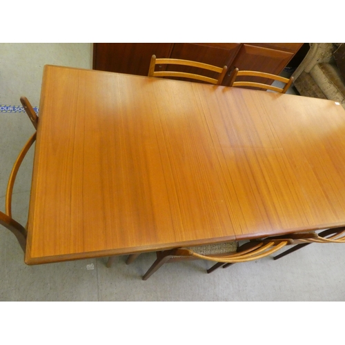 40 - A 1970s teak G-Plan dining table, raised on turned, tapered legs  29