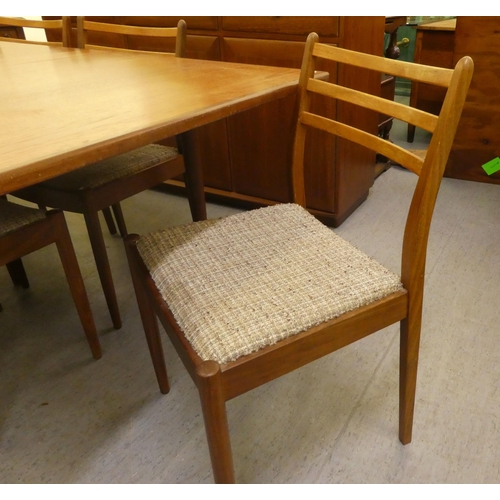 40 - A 1970s teak G-Plan dining table, raised on turned, tapered legs  29