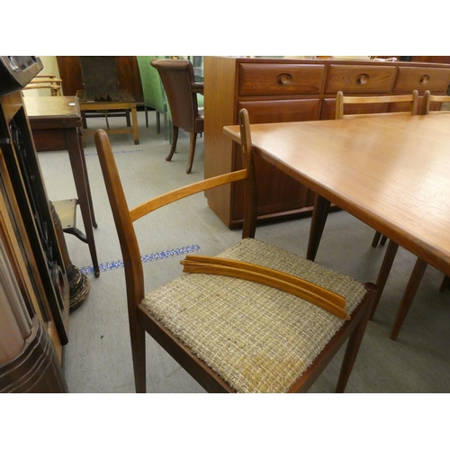 40 - A 1970s teak G-Plan dining table, raised on turned, tapered legs  29