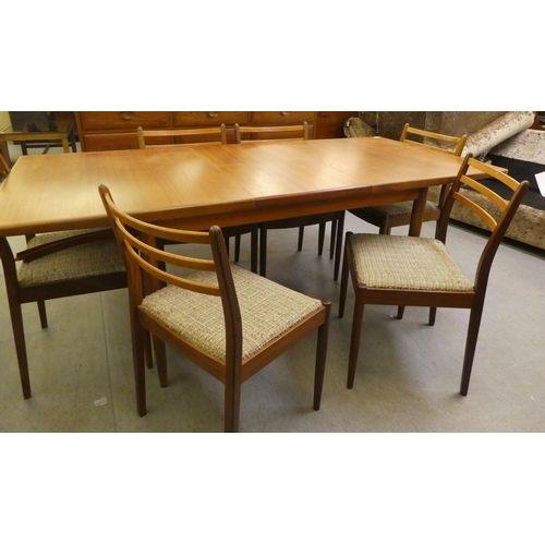 40 - A 1970s teak G-Plan dining table, raised on turned, tapered legs  29